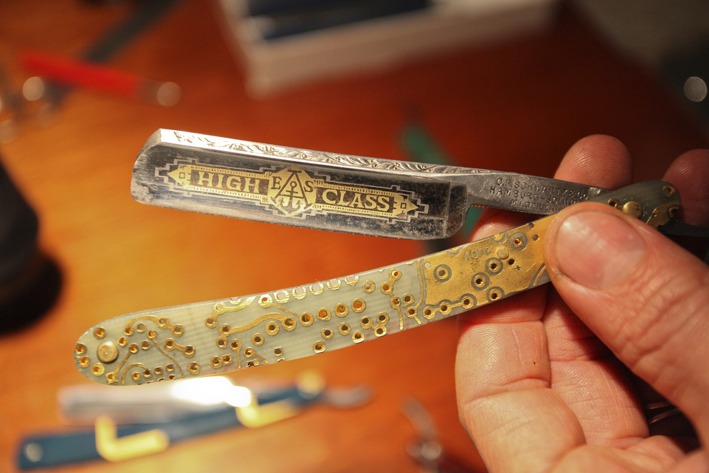 A straight razor with a handle made from a silicon circuit board