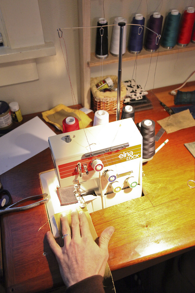 An Elna Lock sewing machine mid-stitch