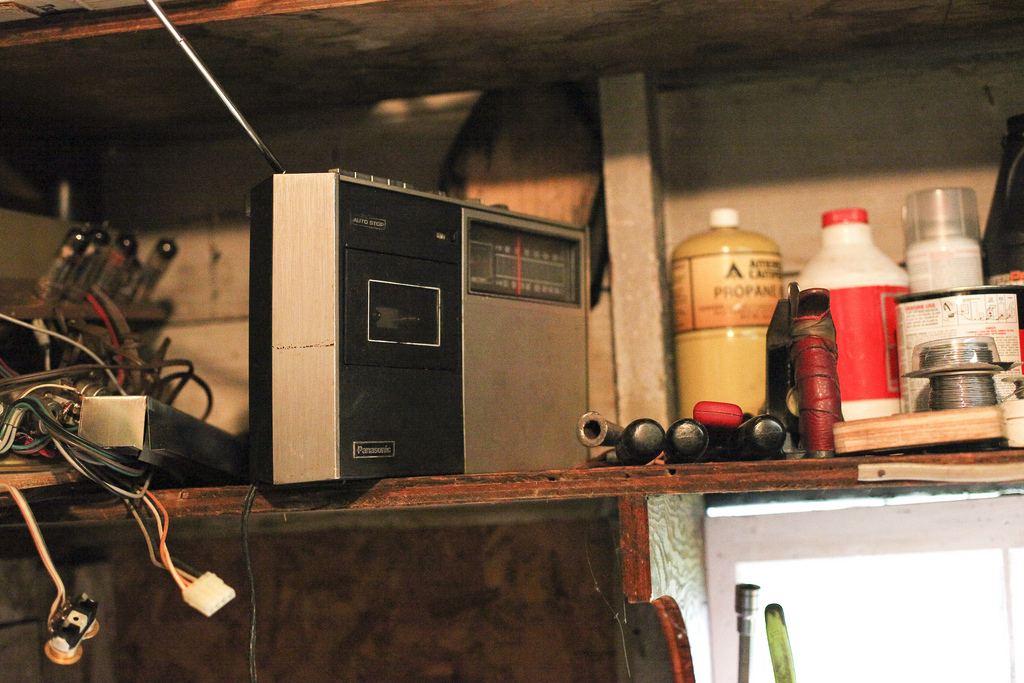 A salvaged Panasonic receiver with its antenna raised, on the workshop shelf